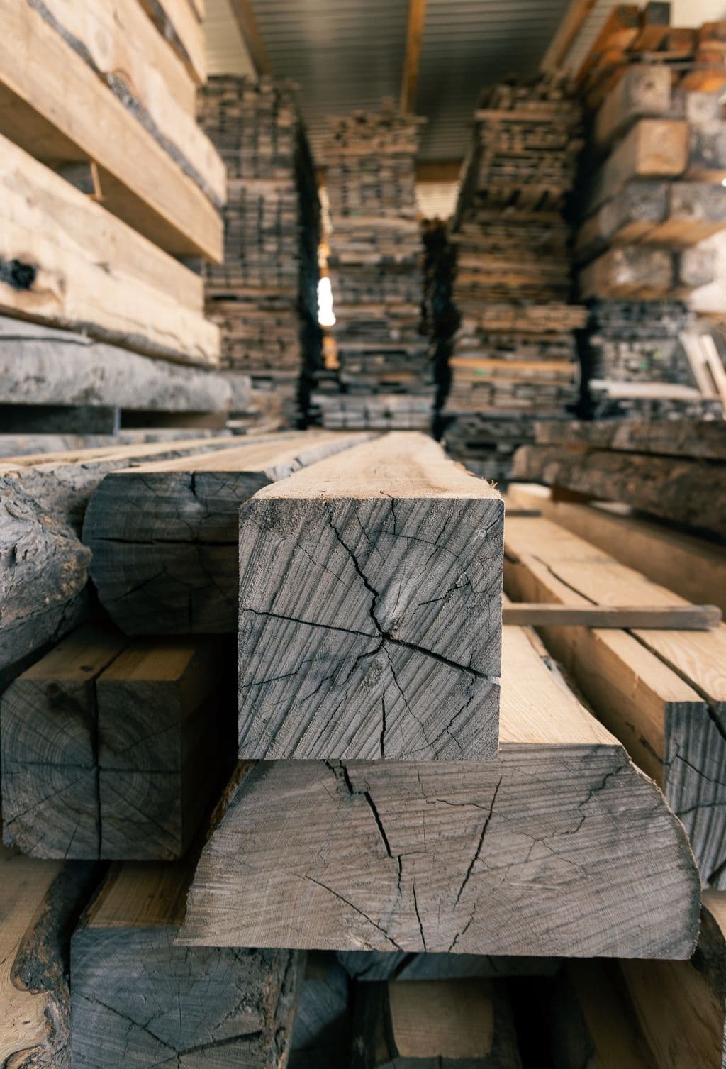 Closeup of ash timber beams in timber yard - Heritage Timbercraft