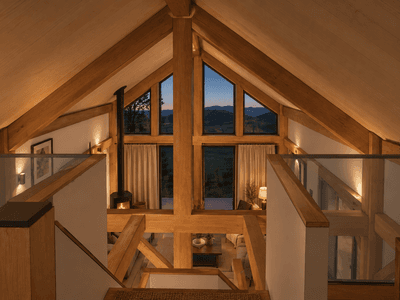 Elegant 105m² small timber home with loft designed for downsizers and Airbnb holiday rentals, view from the loft