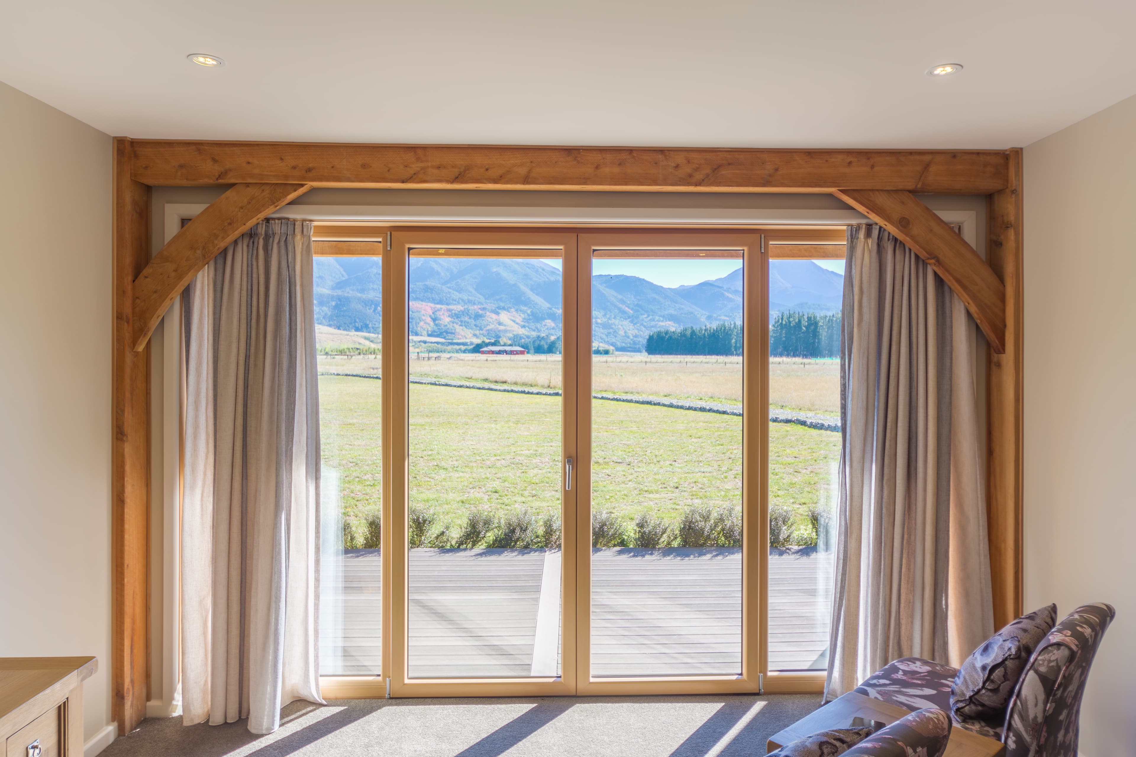 Timber frame bed and breakfast in Hanmer, NZ. Bedroom with a gorgeous alpine view