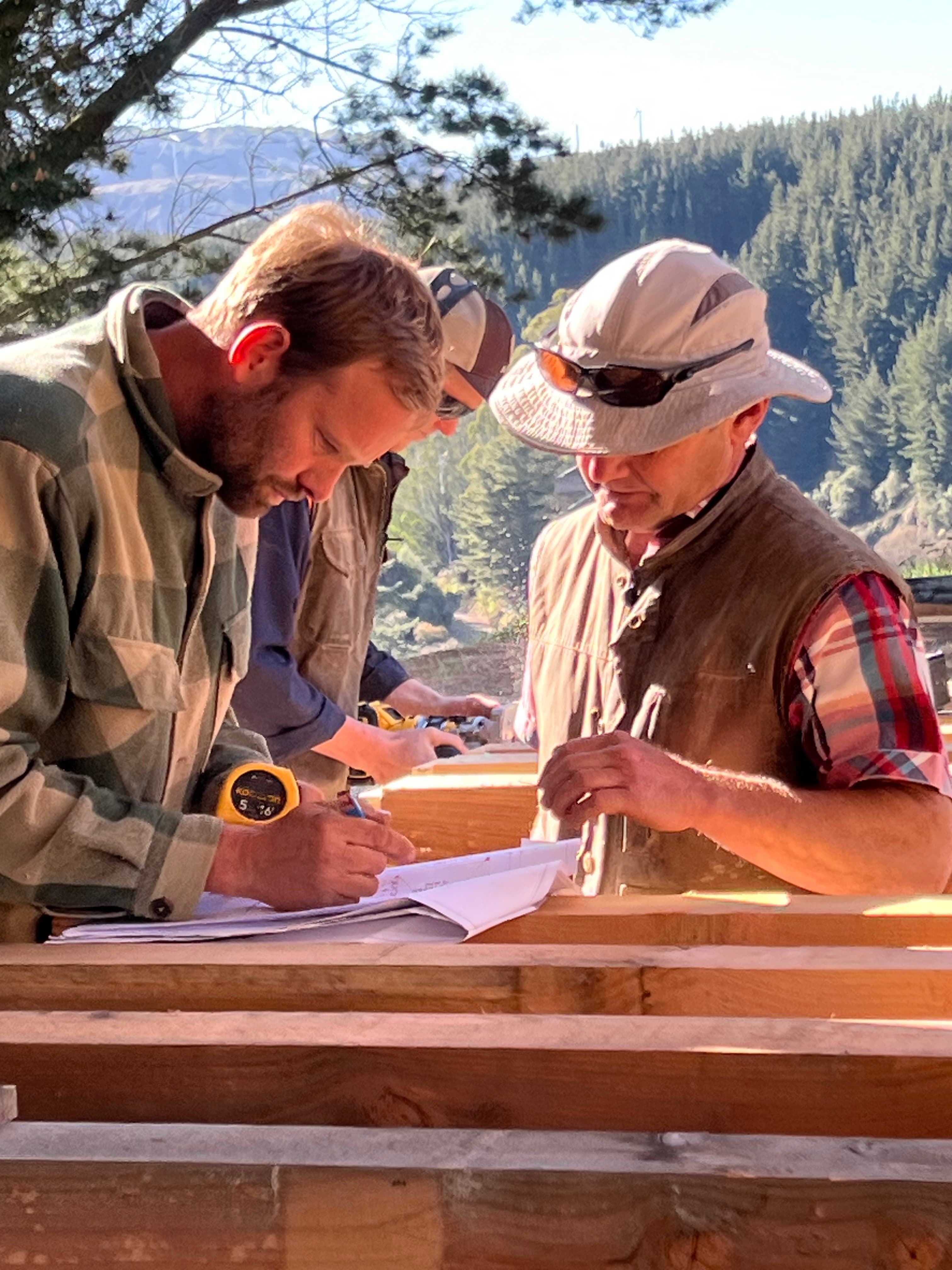 Master carpenters working hard in crafting premium timber for a kitset barn home